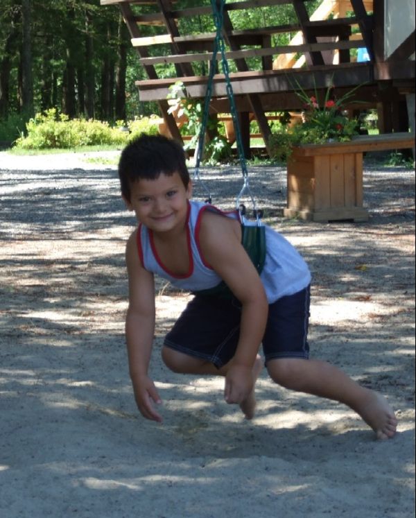 swings on beach at Elm Cove Cottages