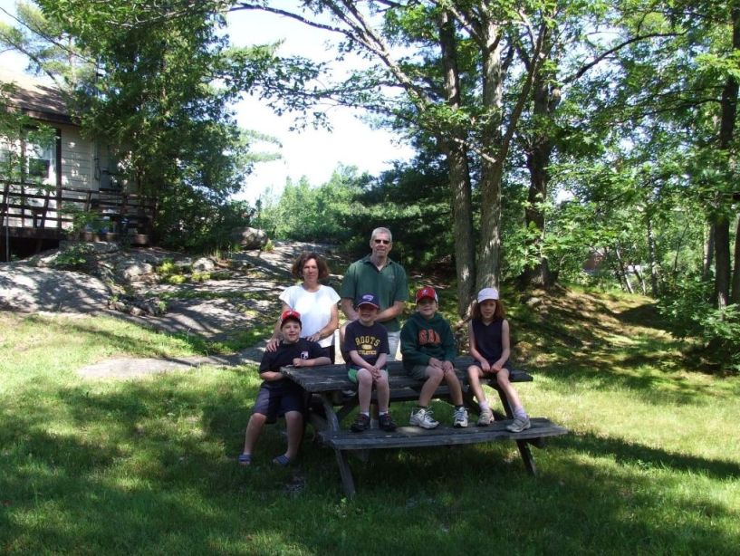 Family picnic by cottage #1